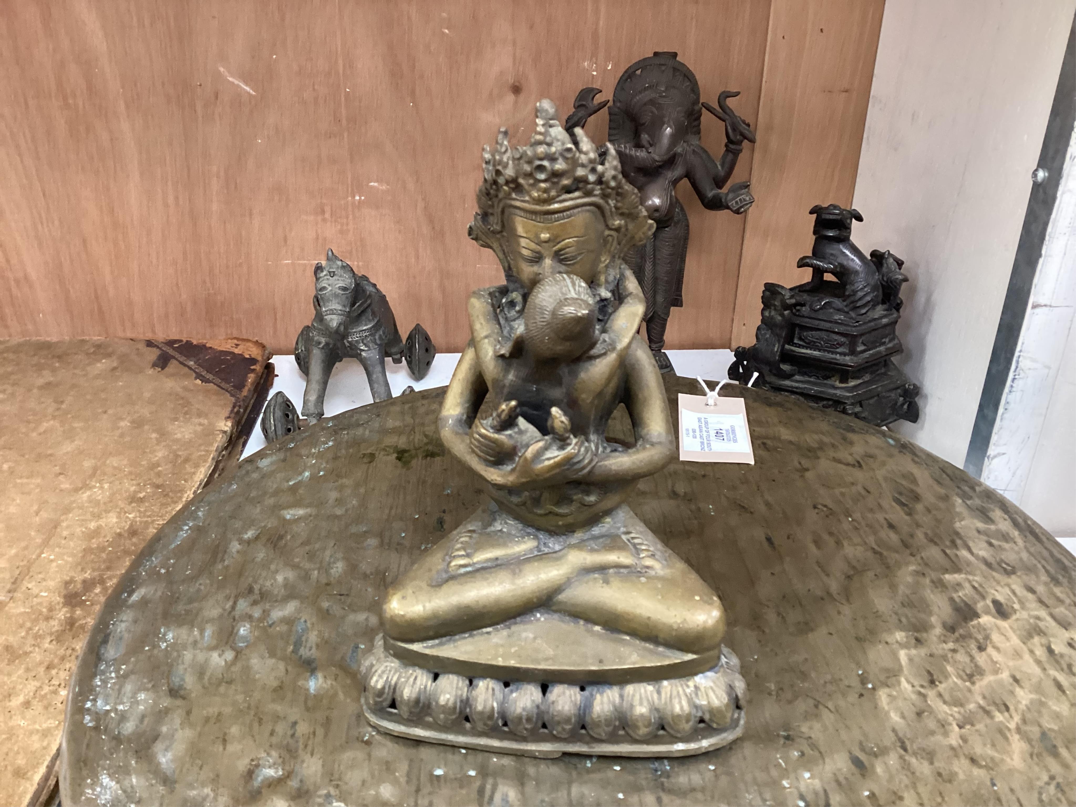 A group of four south east Asian cast bronzes and a gong with mount and beater, 40.5cm